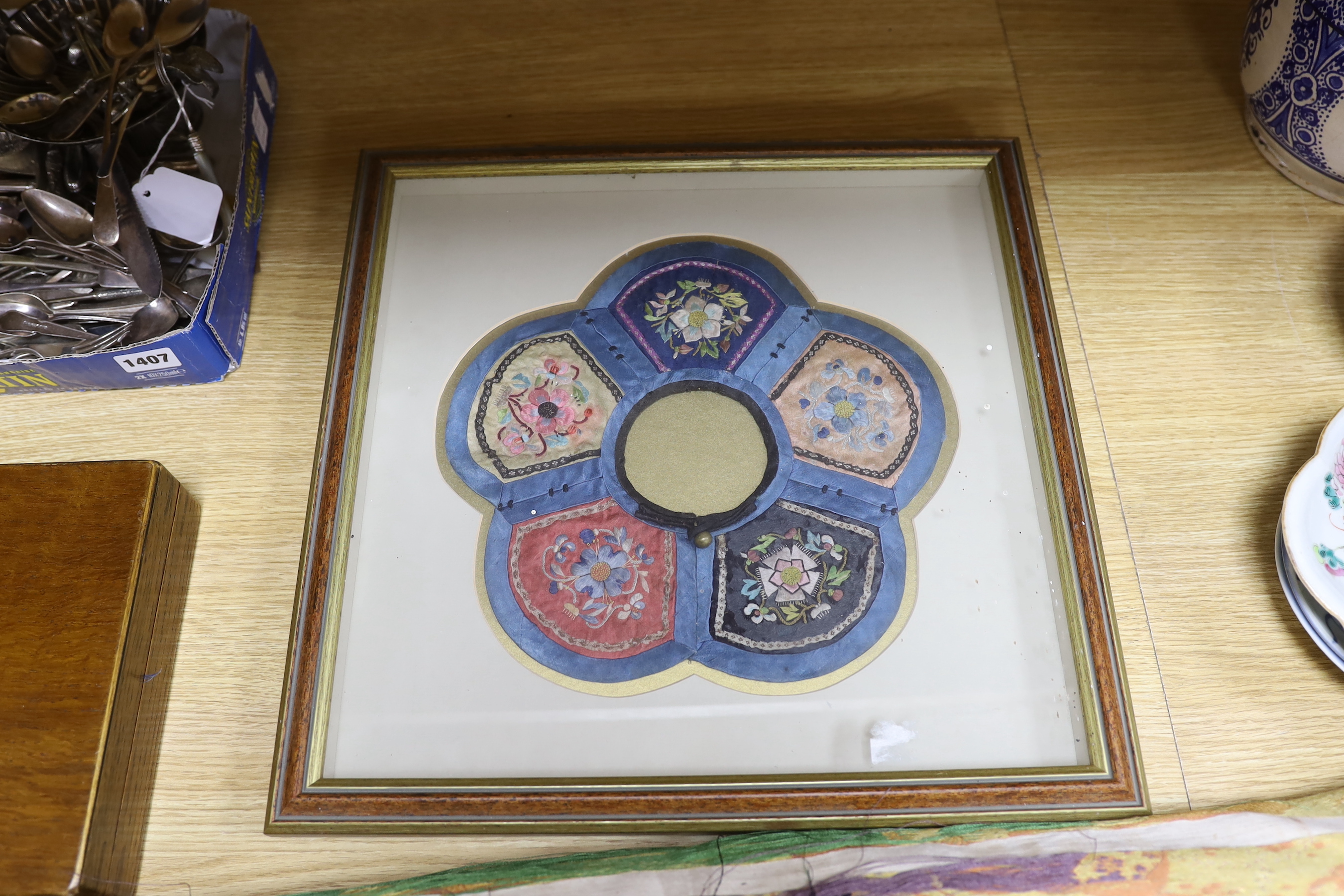 A roll of Japanese brocade fabric, (possibly for an Obi) and a framed Chinese silk embroidered child’s collar, collar 27cm diameter